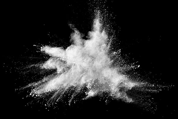 White powder explosion on black background