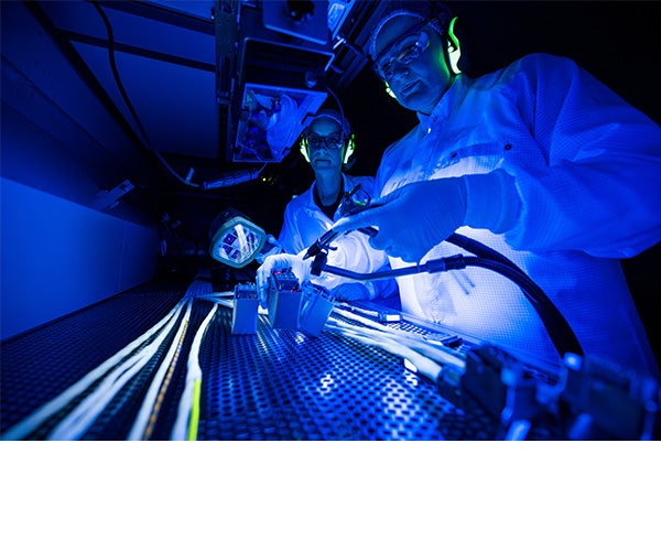 Two Associates working on a lithography product.