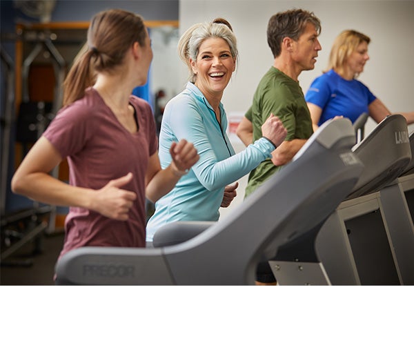 Associates working out in a fitness center.