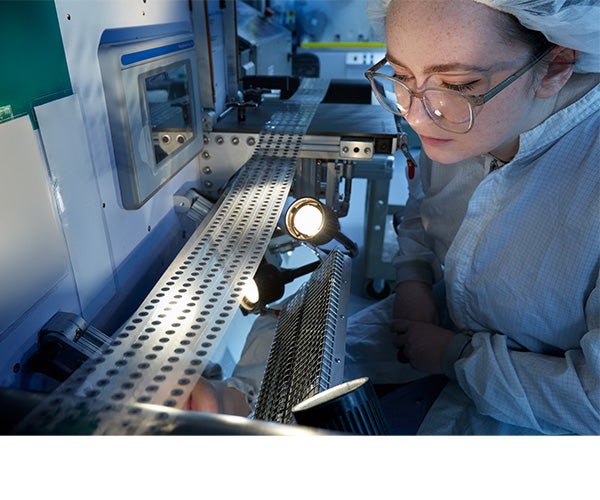 An Associate working on vent production.