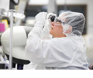 An Associate working in a clean room.